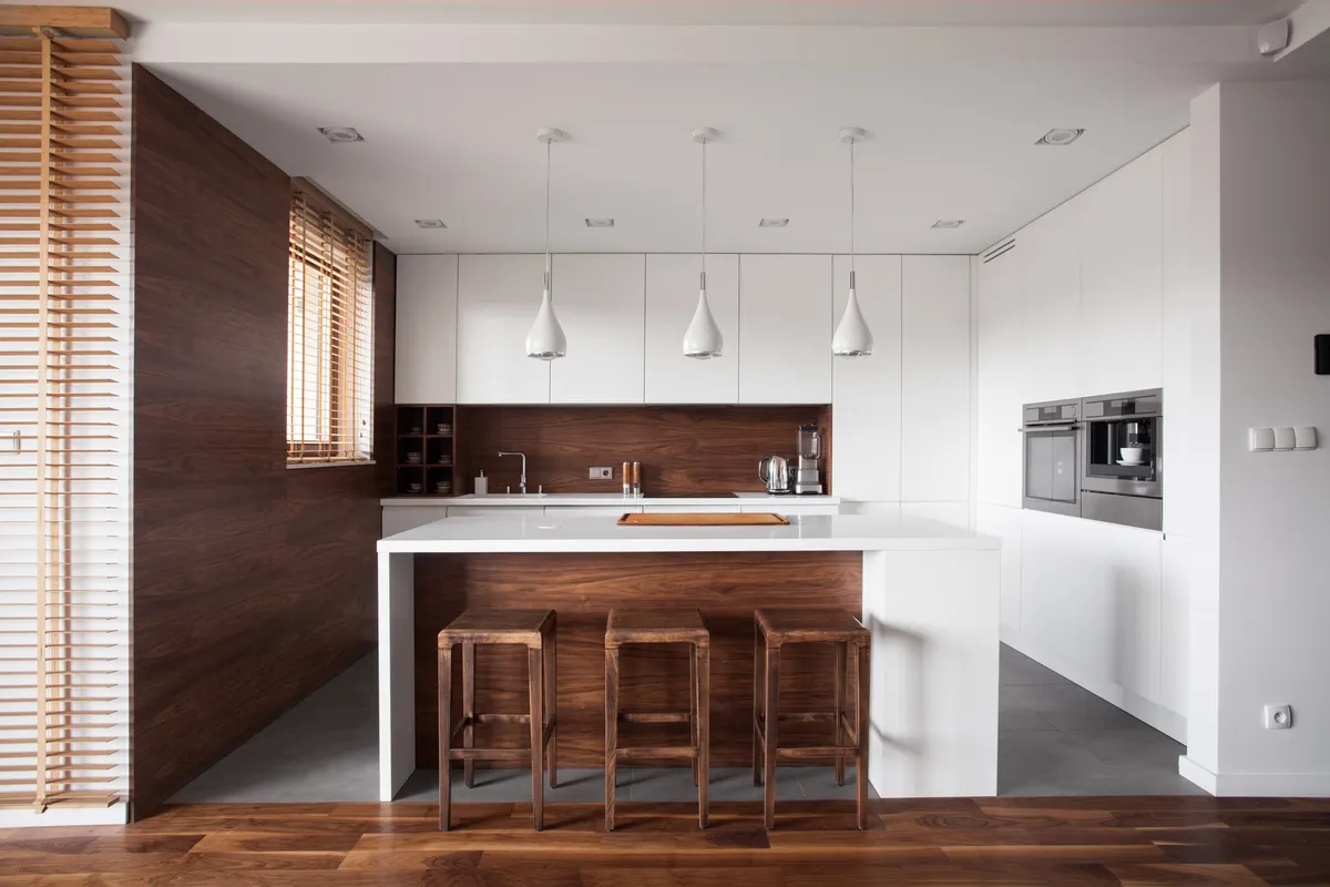 White kitchen with wood accent wall